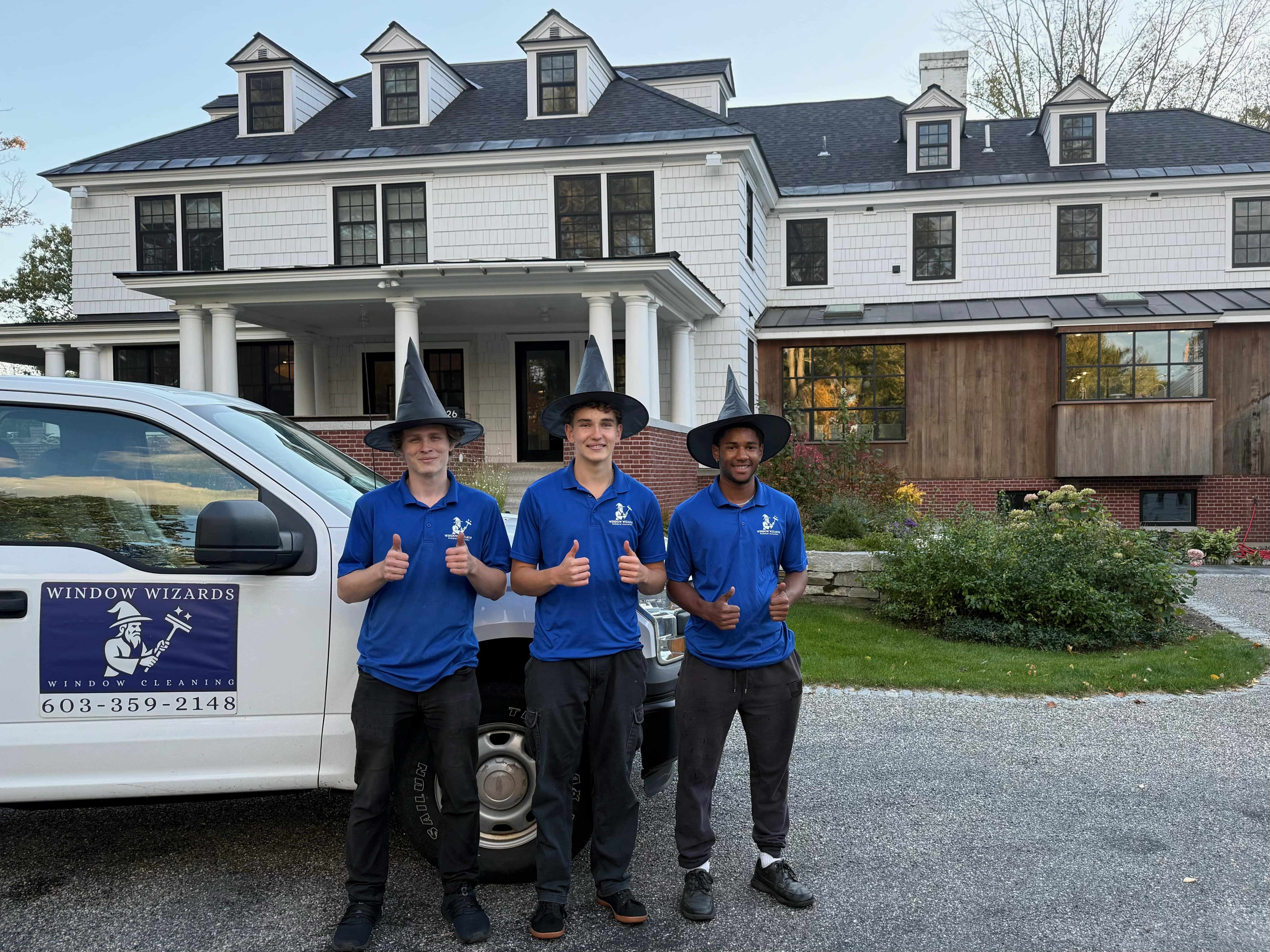 Window Wizards team giving thumbs up